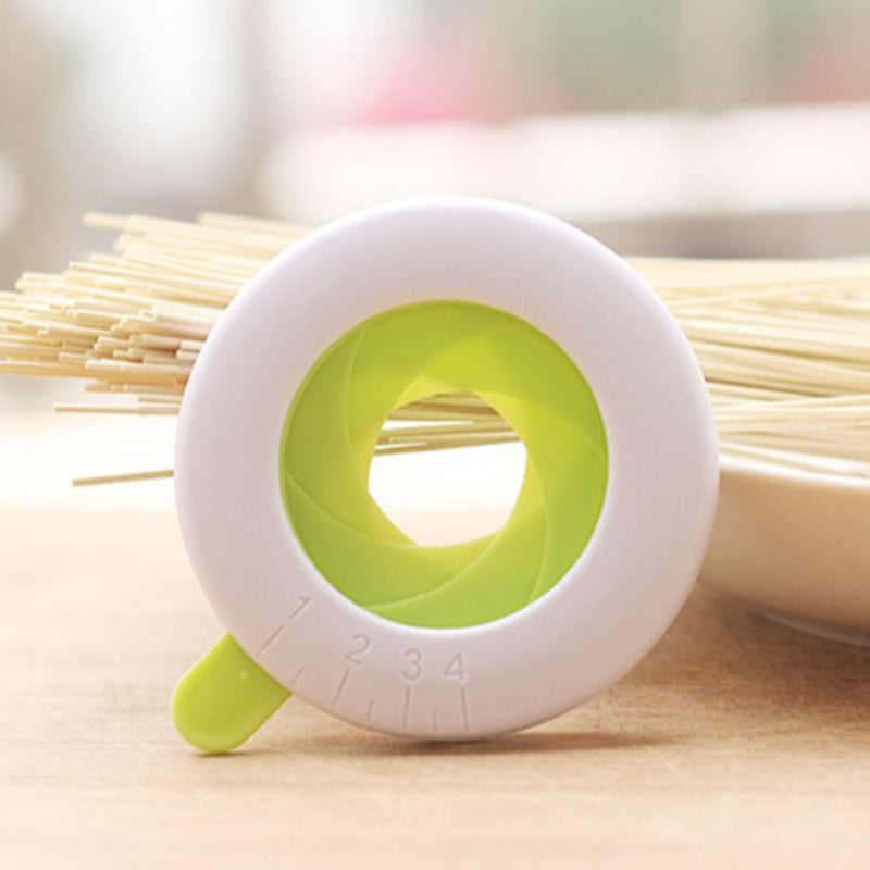 Close-up of a durable plastic spaghetti portion tool used for accurately measuring pasta portions, featuring a compact and easy-to-use design. Ideal as a pasta measuring tool, spaghetti measuring tool, spaghetti measurer, and versatile pasta measurer tool for home kitchens.