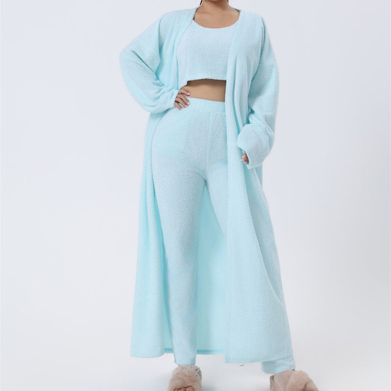 Cozy 3-piece pajama set for women, featuring a soft crop top, wide-leg pants, and a matching knee-length pullover in pastel colors.