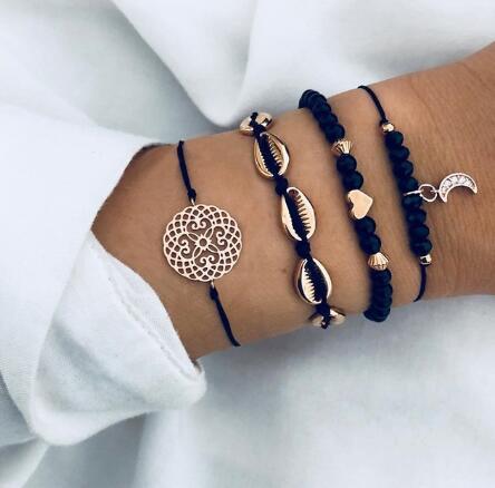 Elegant anklet bracelet featuring a star and moon design, with geometric, love, and flower elements. Includes turtle charm and beaded accents for a unique, boho-inspired look perfect for special occasions like weddings, anniversaries, and birthdays