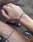 Description: Stylish mens bracelet displayed to demonstrate versatility and elegant aesthetic