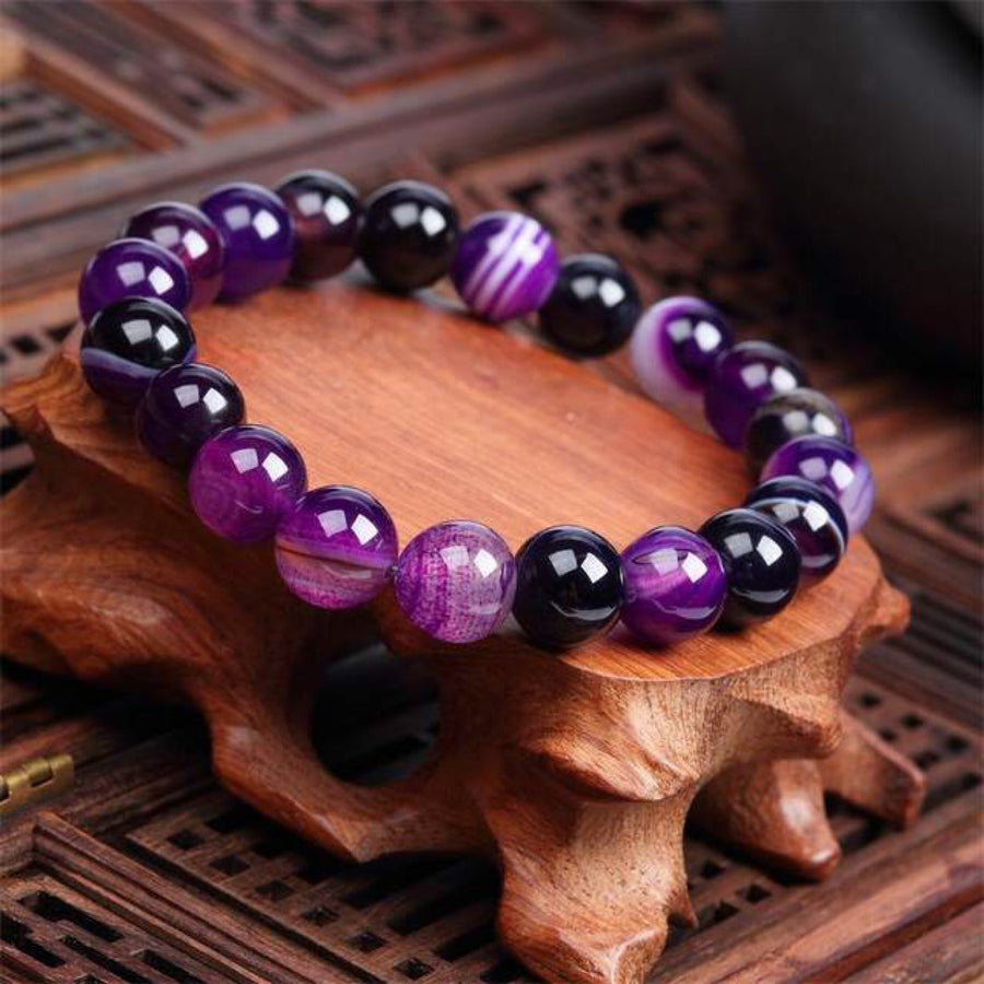 Elegant real amethyst bracelet featuring purple stone beads, perfect for adding a touch of sophistication to any outfit