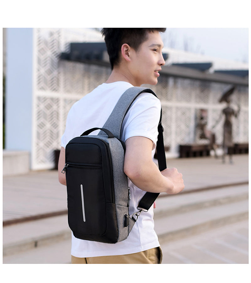 Anti-theft crossbody sling bag made from durable polyester, featuring a USB charging port, computer pocket, and soft surface. Ideal for secure storage and on-the-go charging, with a stylish, casual design and car suture detail.