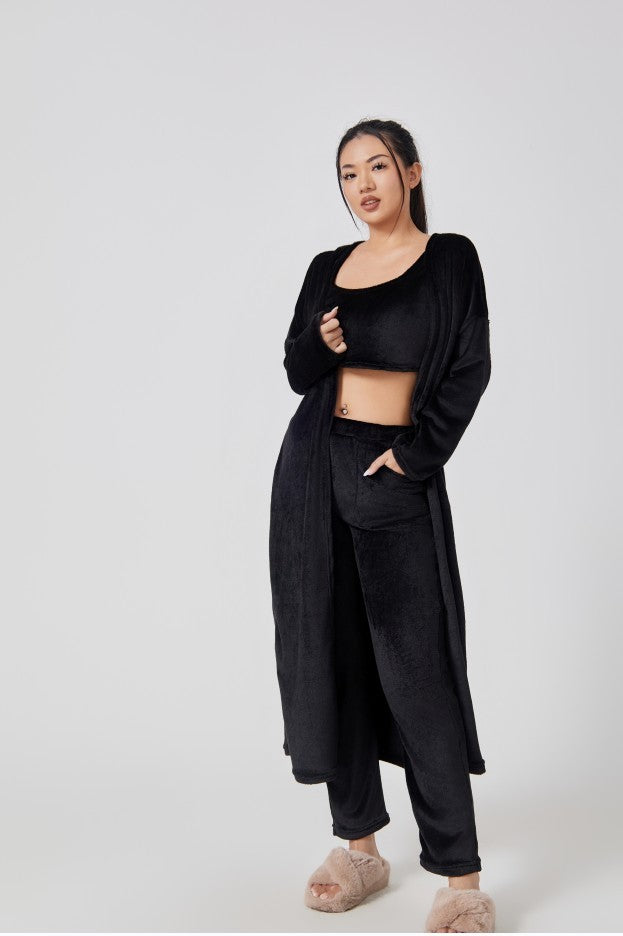 Cozy 3-piece pajama set for women, featuring a soft crop top, wide-leg pants, and a matching knee-length pullover in pastel colors.