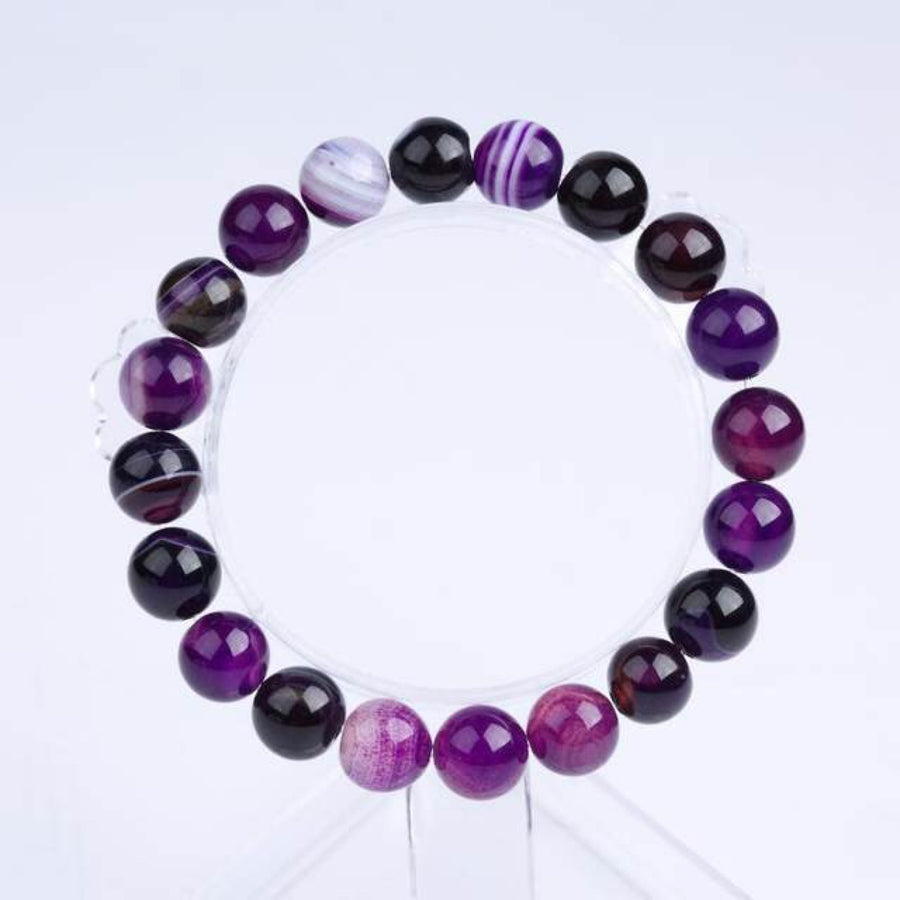 Elegant real amethyst bracelet featuring purple stone beads, perfect for adding a touch of sophistication to any outfit