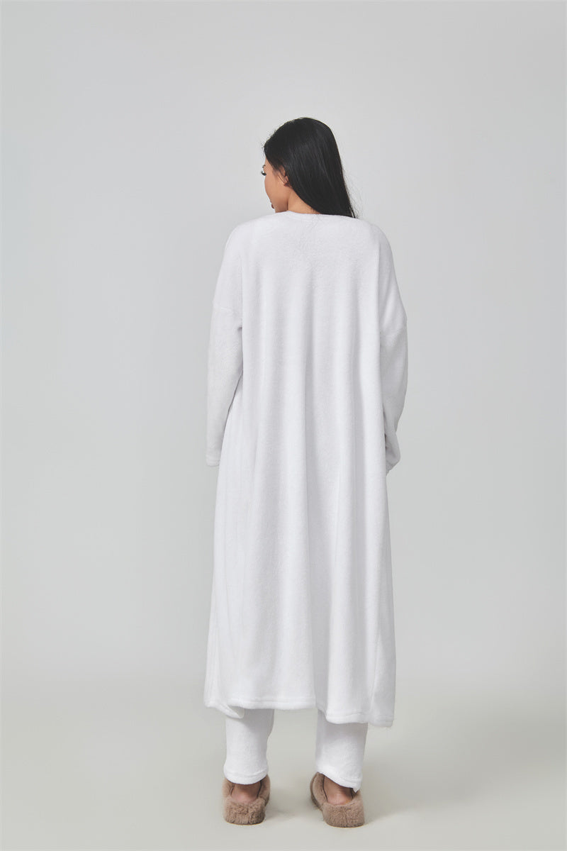 Cozy 3-piece pajama set for women, featuring a soft crop top, wide-leg pants, and a matching knee-length pullover in pastel colors.