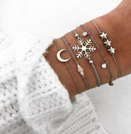 Elegant anklet bracelet featuring a star and moon design, with geometric, love, and flower elements. Includes turtle charm and beaded accents for a unique, boho-inspired look perfect for special occasions like weddings, anniversaries, and birthdays