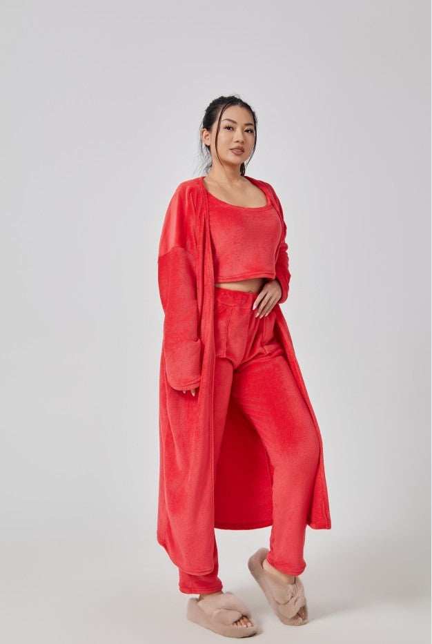 Cozy 3-piece pajama set for women, featuring a soft crop top, wide-leg pants, and a matching knee-length pullover in pastel colors.