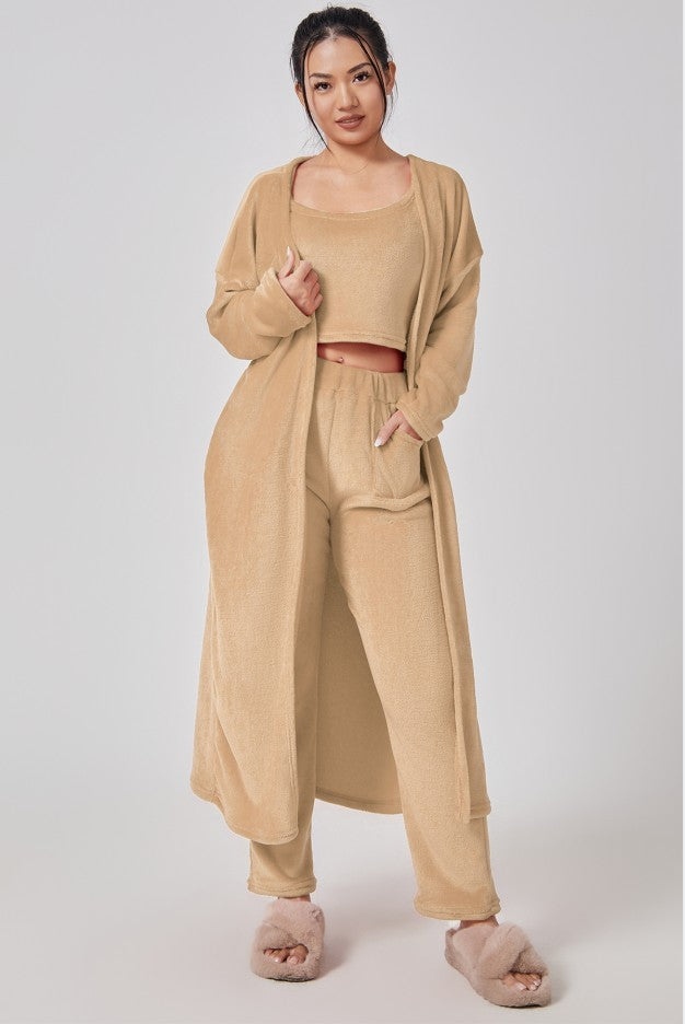 Cozy 3-piece pajama set for women, featuring a soft crop top, wide-leg pants, and a matching knee-length pullover in pastel colors.