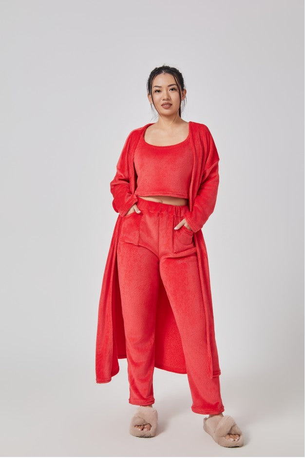 Cozy 3-piece pajama set for women, featuring a soft crop top, wide-leg pants, and a matching knee-length pullover in pastel colors.