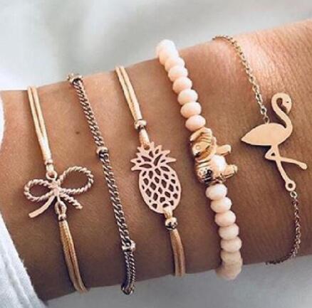 Elegant anklet bracelet featuring a star and moon design, with geometric, love, and flower elements. Includes turtle charm and beaded accents for a unique, boho-inspired look perfect for special occasions like weddings, anniversaries, and birthdays