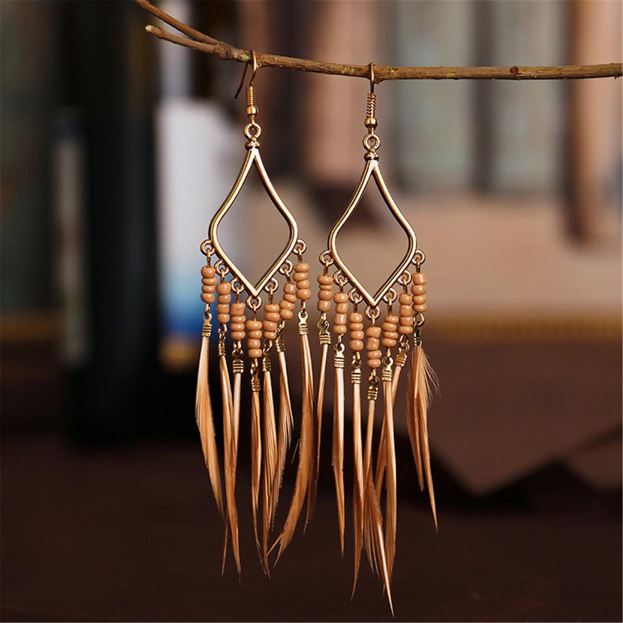 Tassels feather earrings Bohemian feather earrings Fringe feather earrings Statement feather earrings Boho chic earrings Long feather earrings Dangle tassel earrings Trendy feather earrings Fashionable tassel earrings Feather jewelry accessories