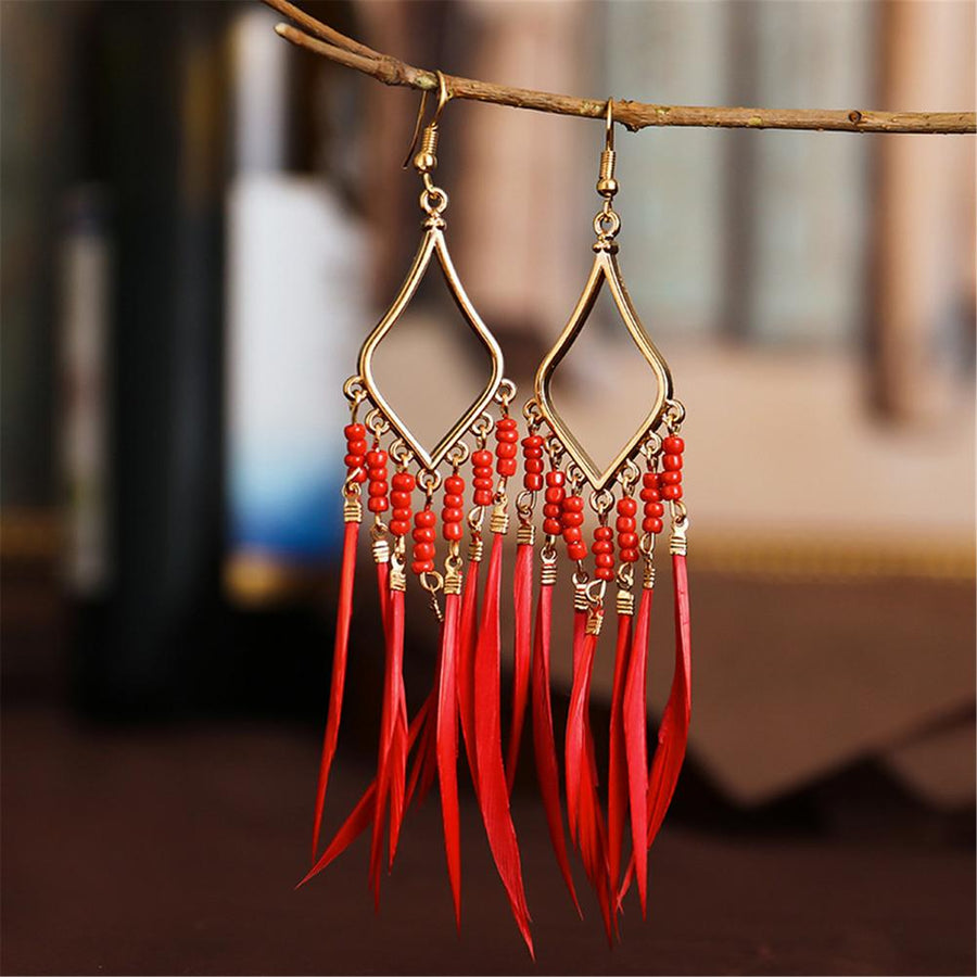 Tassels feather earrings Bohemian feather earrings Fringe feather earrings Statement feather earrings Boho chic earrings Long feather earrings Dangle tassel earrings Trendy feather earrings Fashionable tassel earrings Feather jewelry accessories