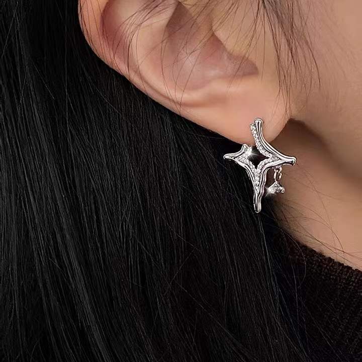 Celestial-inspired earrings Sparkling rhinestone jewelry Asterism pattern earrings Elegant rhinestone accessories Night sky-inspired earrings Glamorous starry earrings Mesmerizing rhinestone studs Eye-catching celestial jewelry Elegant statement earrings Sparkling asterism earrings