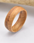 Reclaimed wood ring Whiskey barrel jewelry Rustic barrel ring Handcrafted wood ring Unique wood grain ring Vintage whiskey barrel ring Artisanal barrel wood ring Aged wood band Distinctive barrel ring Heritage-inspired ring