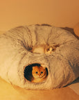 Round tunnel cat bed Dual-purpose cat furniture Cat bed with attached tunnel Cozy hideaway for cats Interactive cat sleeping space Plush round bed for cats Tunnel bed for feline fun Comfy cat nap spot Cat tunnel bed combo Multi-functional cat sleeping accessory